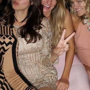 Long sleeve metallic see through dress.